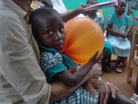 picture enlargement - African Boy Holding Orange Balloon - HPIM1982.jpg