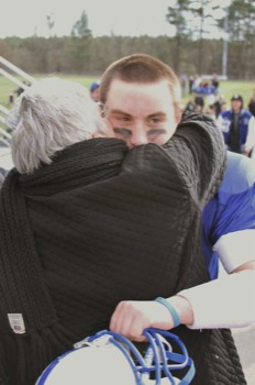 poster - Woman Hugging Football Player - zachwithnana.jpg